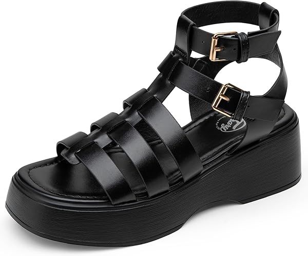 a black leather platform sandal with multiple straps and buckles.