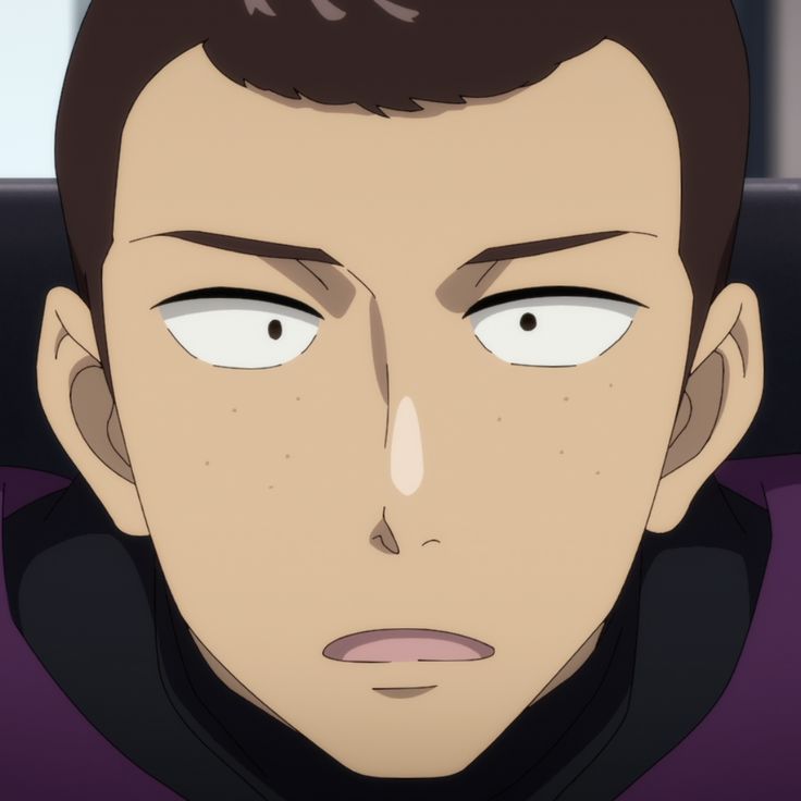 a closeup shot of an anime character's face. the character has brown hair, freckles, and a surprised expression. he is wearing a purple and black collar. the background is blurred.