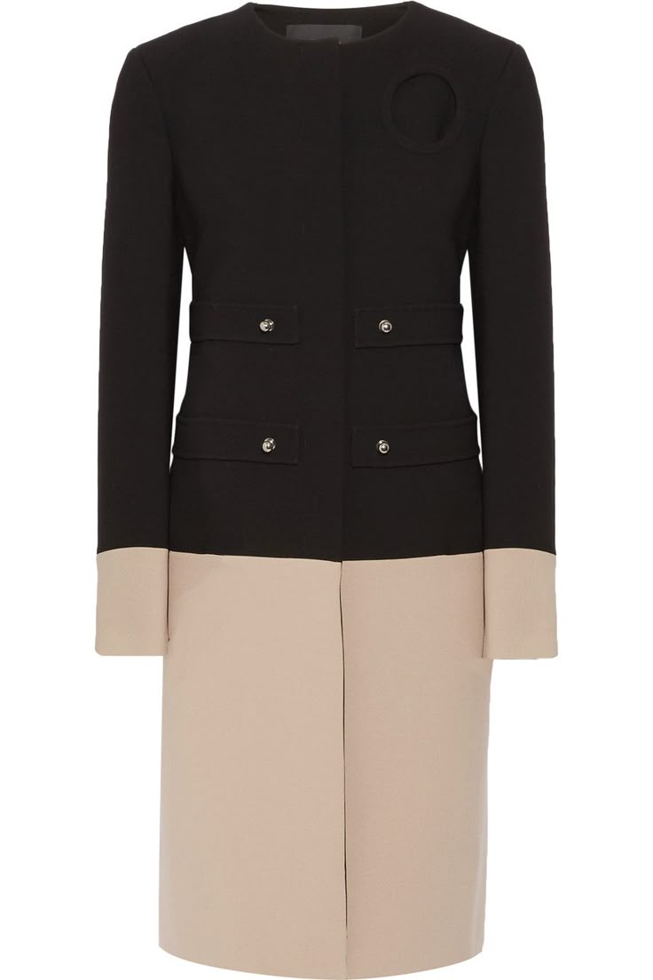 a kneelength dress is displayed, showcasing a design that combines both classic and modern elements. the upper part of the dress is black with long sleeves and features a round neckline. there are subtle details such as small square pockets on either side, each adorned with a small metal button. the standout element is a circular cutout detail on the right side of the upper chest. the lower portion of the dress is beige and extends to just below the knees. the color contrast between the black upper and beige lower sections creates a visually striking effect. the dress appears to be made of a smooth, structured fabric.