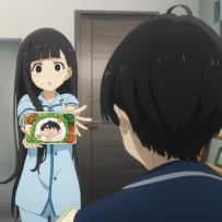 the image is a digital illustration from an anime. it shows a girl and a boy in a school setting, with the girl holding a lunch box towards the boy. the boy is smiling and the girl seems happy.  the image is most likely from a manga, as there are speech bubbles in the image. the artwork is colorful and vibrant, with a soft background and bright foreground colors. the overall tone is one of friendly interaction and lightheartedness.