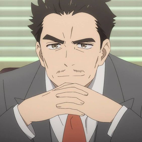 the image shows a closeup illustration of an adult male anime character with dark hair, brown eyes, and a mustache.  he is wearing a gray suit with a white shirt and red tie. he has a serious expression on his face and is sitting with his hands clasped in front of him. the environment suggests he is in an office setting, as indicated by the window blinds in the background. the lighting appears to be indoor and the perspective is at eye level.