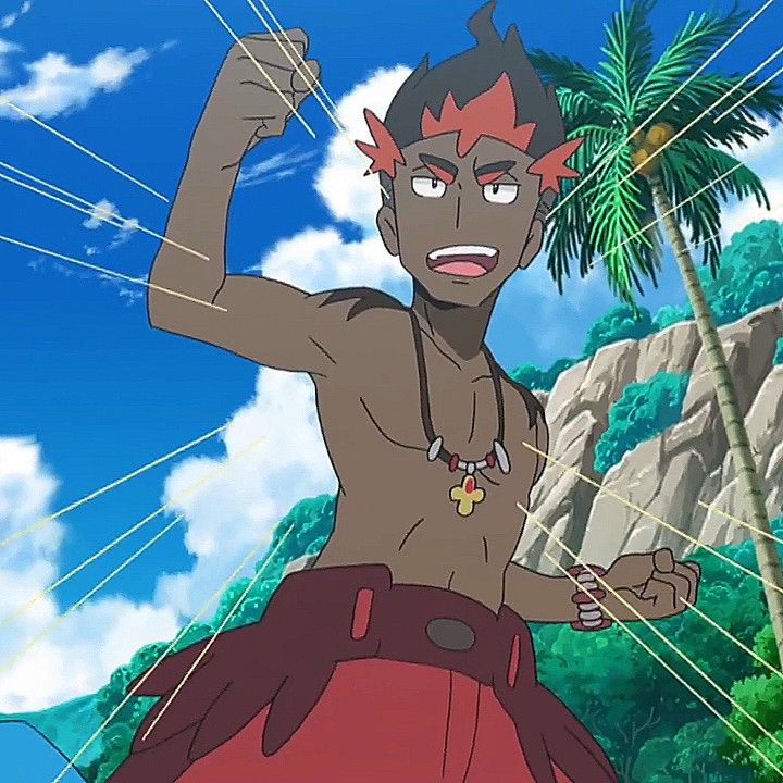 a shirtless male anime character with dark skin, red hair, red pants and a cross necklace is smiling confidently and lifting his fist up in the air. he is standing in front of a tropical beach, palm trees, rocks and bright blue sky.  he looks strong and cheerful.