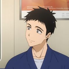 an animestyle illustration shows the upper torso of a young man with short black hair and kind eyes, smiling subtly. he is wearing a blue collared shirt and appears to be a passenger on public transit. the background features a partially visible advertisement poster and the interior wall of a train car. the overall palette is warm and inviting, with soft lighting.