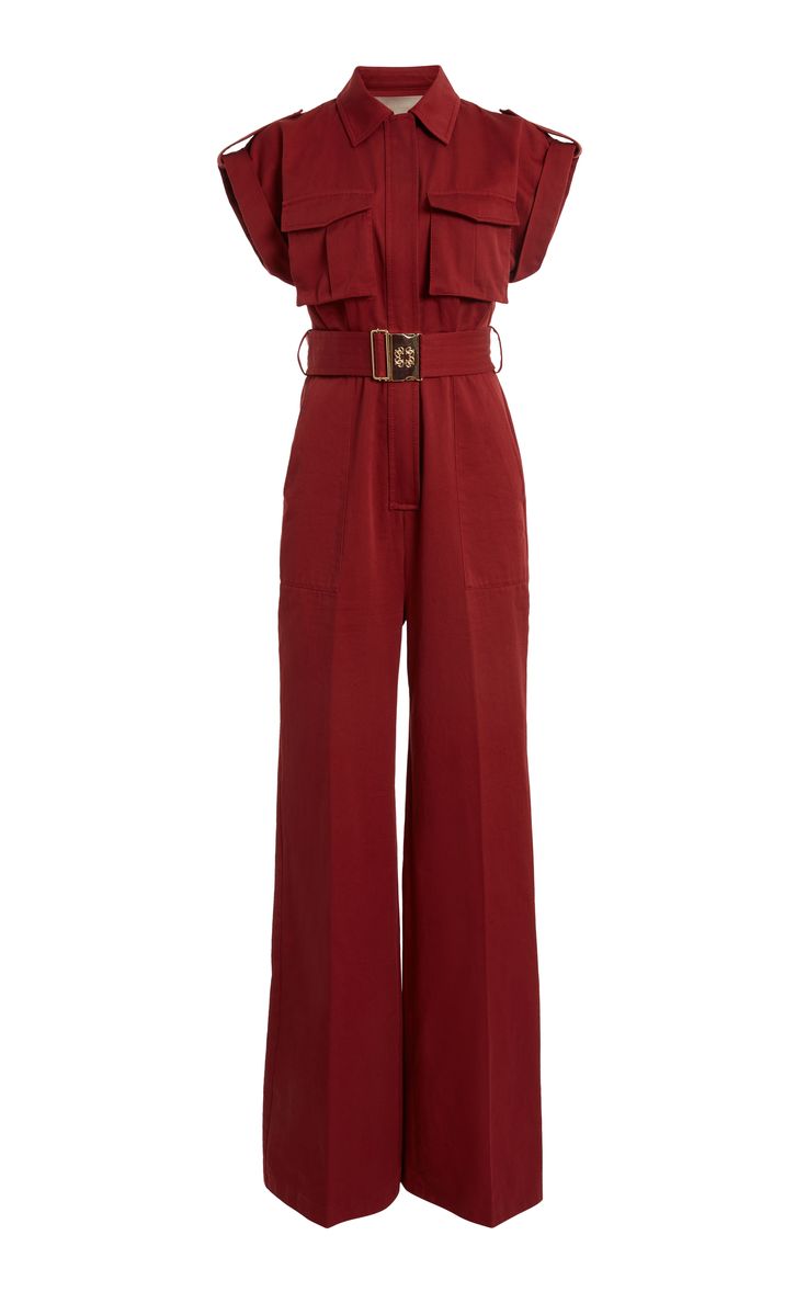 a red, wide leg jumpsuit with short sleeves and a collared neckline. the jumpsuit has a belt, pockets, and a casual style.