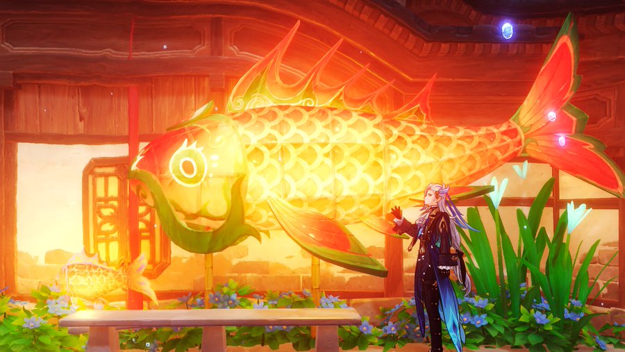 the image is a screenshot from the video game genshin impact, specifically depicting a scene from the lantern rite festival, a chinese new year event held in the liyue region of the game. the scene features the traveler (either aether or lumine) standing in front of a large, glowing koi fish lantern. the lantern is intricately designed with vibrant colors and traditional patterns. the setting is a peaceful garden with blue flowers, situated near a beautiful wooden pavilion bathed in warm, sunset lighting. a smaller, similar koi fish lantern is visible in the foreground.  the overall atmosphere is festive and magical, reflecting the game's fantasy setting and the celebratory nature of the lantern rite event.