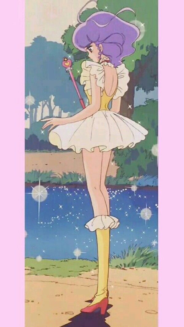 the image depicts a fullbody shot of an anime girl from the back, wearing a white dress with a yellow undertone and a high frilly collar. she has purple hair and is holding a magical staff with a heartshaped head. she is standing in a whimsical outdoor setting with trees and a shimmering body of water. she is wearing high yellow boots with red heels. the overall style has a retro anime aesthetic.