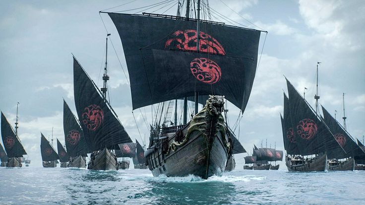 the image depicts a large fleet of black sailing ships at sea.  each ship's sails bear the targaryen sigil – a threeheaded dragon – in red.  the ships are large and imposing, suggesting a significant naval force. the style of the ships suggests a medieval or fantasy setting.  the scene is reminiscent of a major naval action, likely from the television series game of thrones. the central ship is larger and more elaborately decorated than the others, possibly signifying a flagship. the overall mood is one of power, impending conflict, and the imposing presence of the targaryen fleet.