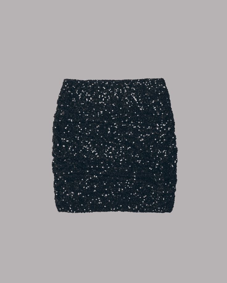 a black sequined mini skirt with a smooth, even texture, giving off an impression of sophistication and glamour.  the skirt is short and fitted, making it a great choice for a night out or party. the sequin material adds a touch of sparkle and shine, making it a standout piece.