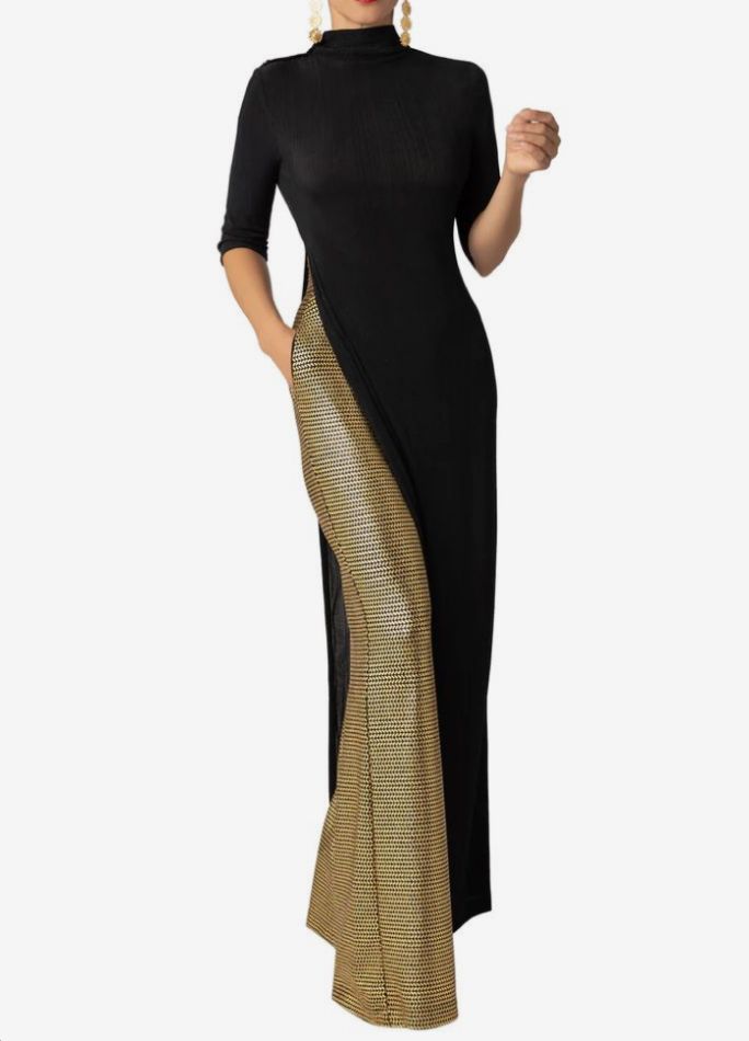 a woman in a black midi dress with a slit on the left side, revealing a gold material underneath. the dress has 3/4 sleeves and a mock neckline.
