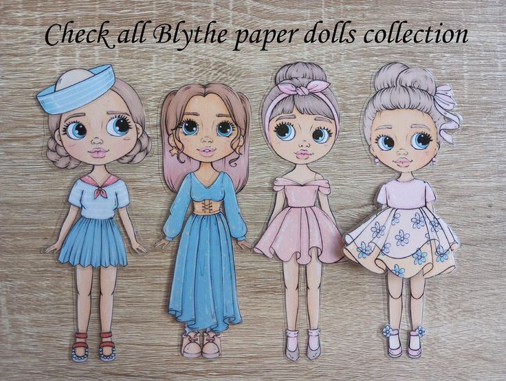 the image shows a collection of four blythe paper dolls with different outfits and hairstyles. from left to right, the dolls wear a sailor dress, a long dress, a pink dress with a headband, and a floral dress. they all have large eyes and cute features. the dolls are set against a wooden background with the text "check all blythe paper dolls collection" at the top.