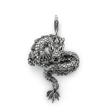 a detailed silver dragon pendant. the dragon is coiled and its tail is turned downwards. the piece is highly detailed, showing the scales and features of the mythical creature. it has a hoop for hanging.