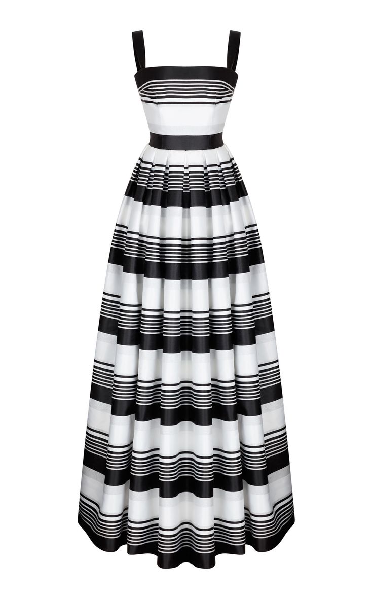a black and white striped sleeveless long dress is standing upright against a white background. the dress has thick shoulder straps and a fitted bodice with a black waistband. the skirt is full and pleated, creating a flowing shape.
