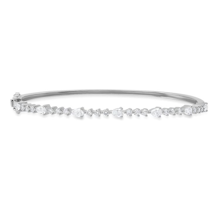 a classic and elegant diamond bangle bracelet, featuring a delicate row of sparkling diamonds set in a smooth silver band. the bracelet is simple yet sophisticated, making it a perfect gift for any occasion.