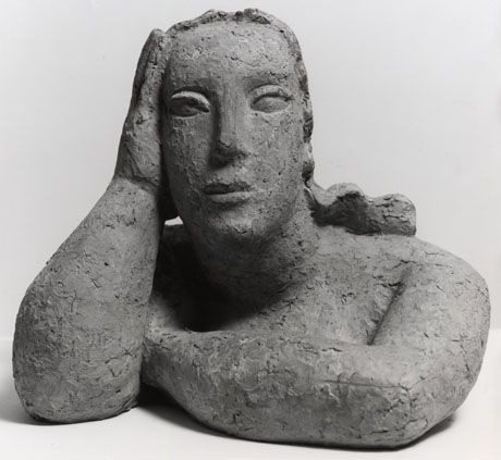 the image shows a monochrome, closeup view of a clay sculpture of a female bust. the woman is leaning on her hand, resting her head against it. her features are stylized and her expression is contemplative. the texture of the clay is visible, adding to the artistic nature of the piece.