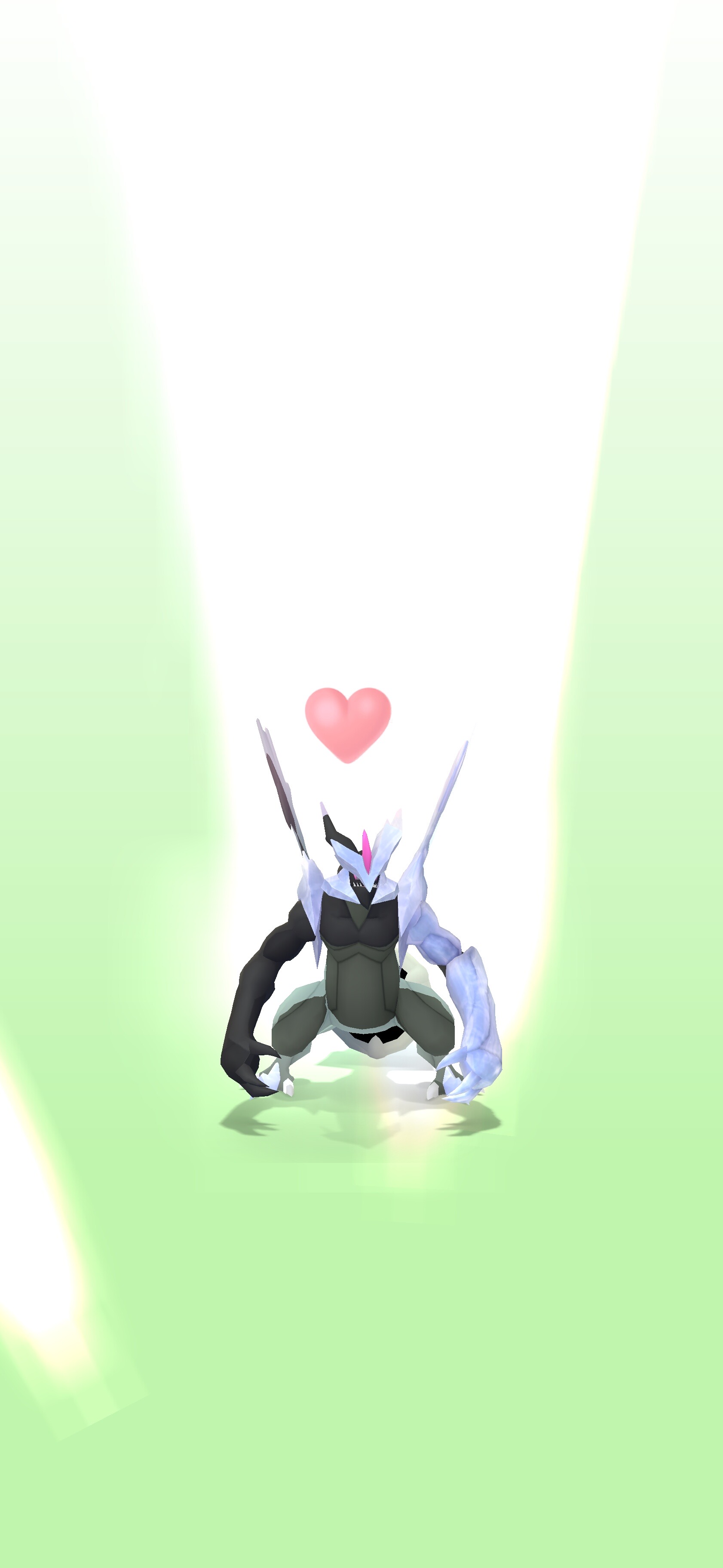 a digital rendering of the pokemon kyurem, positioned in the center of the image, is seen kneeling with a pink heart floating above it. the background is a soft green color with brighter spotlights shining down on the pokemon. the pokemon's design is asymmetrical, with one side appearing dark and the other light.