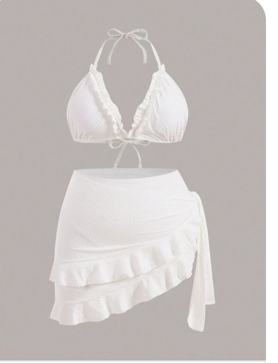 a white twopiece swimsuit is shown against a solid gray background. the bikini top is a halter style with a tie closure and ruffle detailing along the edges. the matching bottoms feature a wraparound design with multiple layers of ruffles. the swimsuit is made from a textured fabric that gives it a slightly wrinkled appearance.