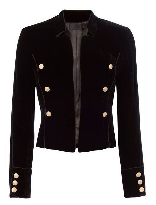 the image shows a black velvet cropped jacket. it has gold buttons down the front and on the cuffs of the sleeves. the jacket is collared and open in the front. the style is military inspired.