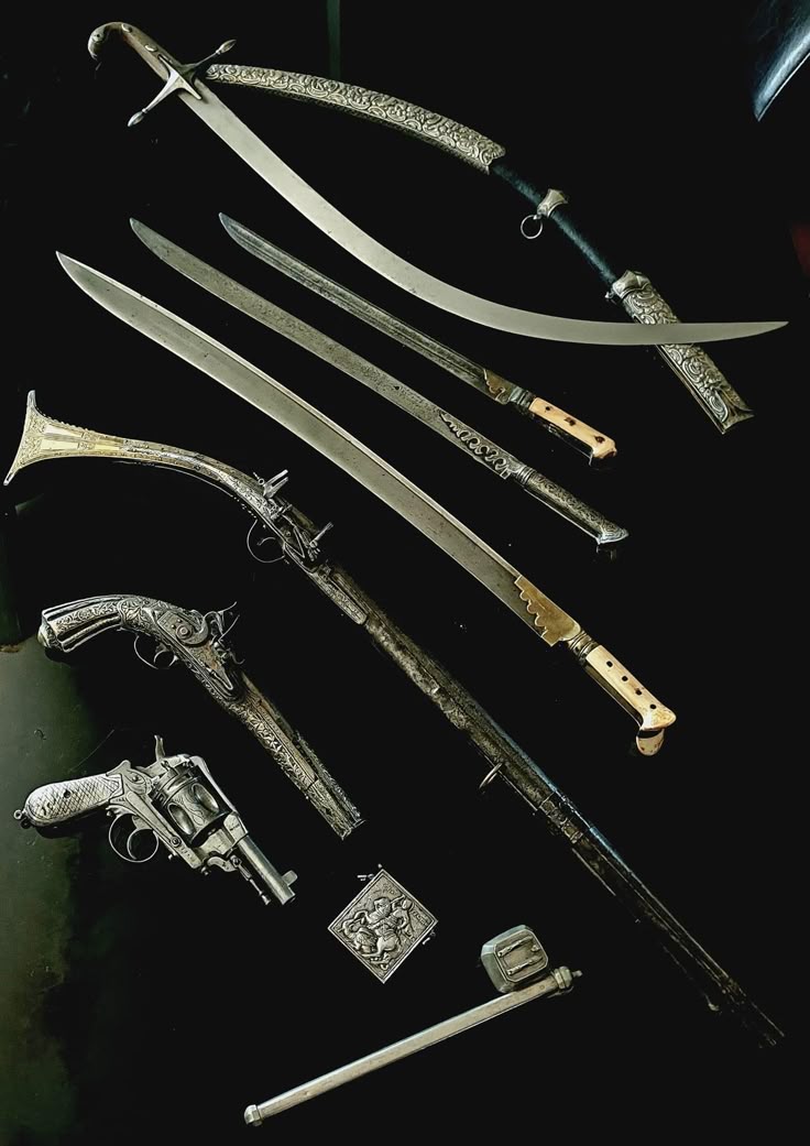 the image displays a collection of antique weapons, primarily consisting of various types of swords, including scimitars and straightbladed swords. also present are several antique pistols, including a revolver, along with a dagger and other small metal objects. all the items appear to be made of metal, primarily silver or a silvercolored metal, and are arranged on a black surface.