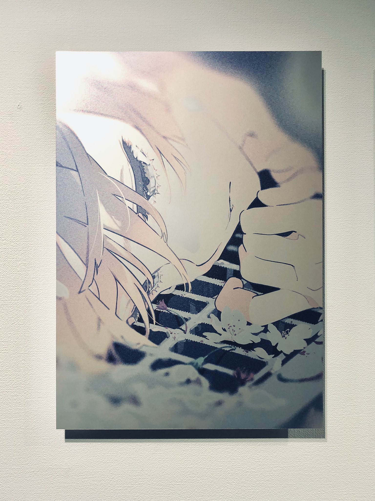 the image showcases a digital illustration of a young woman with flowing blonde hair. she appears melancholic, her eyes downcast, and her hand resting on a metal grate adorned with delicate, white flowers. the setting appears urban, hinting at a city backdrop. the color palette is muted, employing soft pastels and grays to evoke a sense of wistfulness.