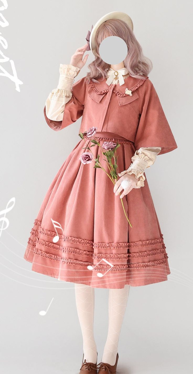a young woman poses in a vintageinspired lolita fashion outfit. she is wearing a peachcolored dress with a ruffled hem and a matching jacket. she has a white blouse with puffed sleeves underneath and a white hat perched atop her head. she is also wearing brown shoes and holds a bouquet of pink roses. the photo is taken indoors in a studio with soft lighting.