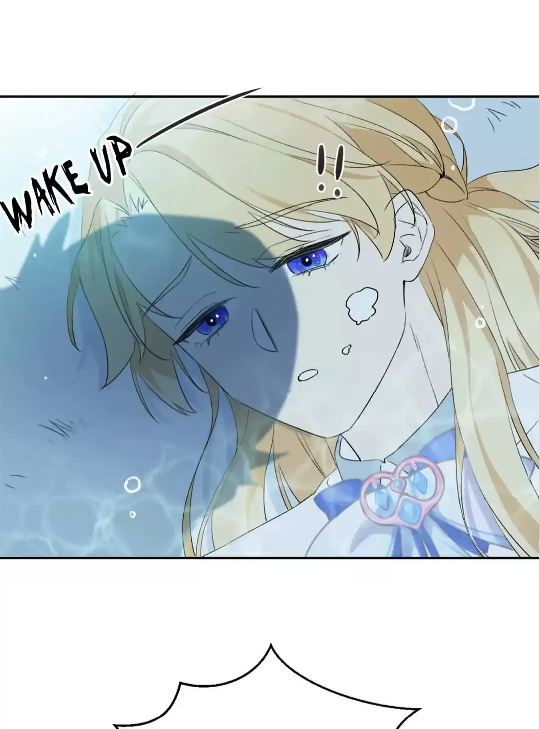 the image is a panel from a manga or anime comic. it features a young blonde girl with blue eyes who appears to be underwater or in a dreamlike state. the text "wake up" is prominently displayed, suggesting she's being roused from sleep or unconsciousness. the girl's expression is a mix of surprise and confusion. the overall color palette is light and pastel, creating a dreamy and ethereal atmosphere.