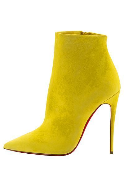 the image showcases a single, bright yellow suede ankle boot with a pointed toe and a very high, thin stiletto heel.  the sole appears to be red, characteristic of some designer brands. the boot is shown against a plain white background, highlighting its vibrant color and sleek silhouette.  the overall impression is one of high fashion and stylish footwear.