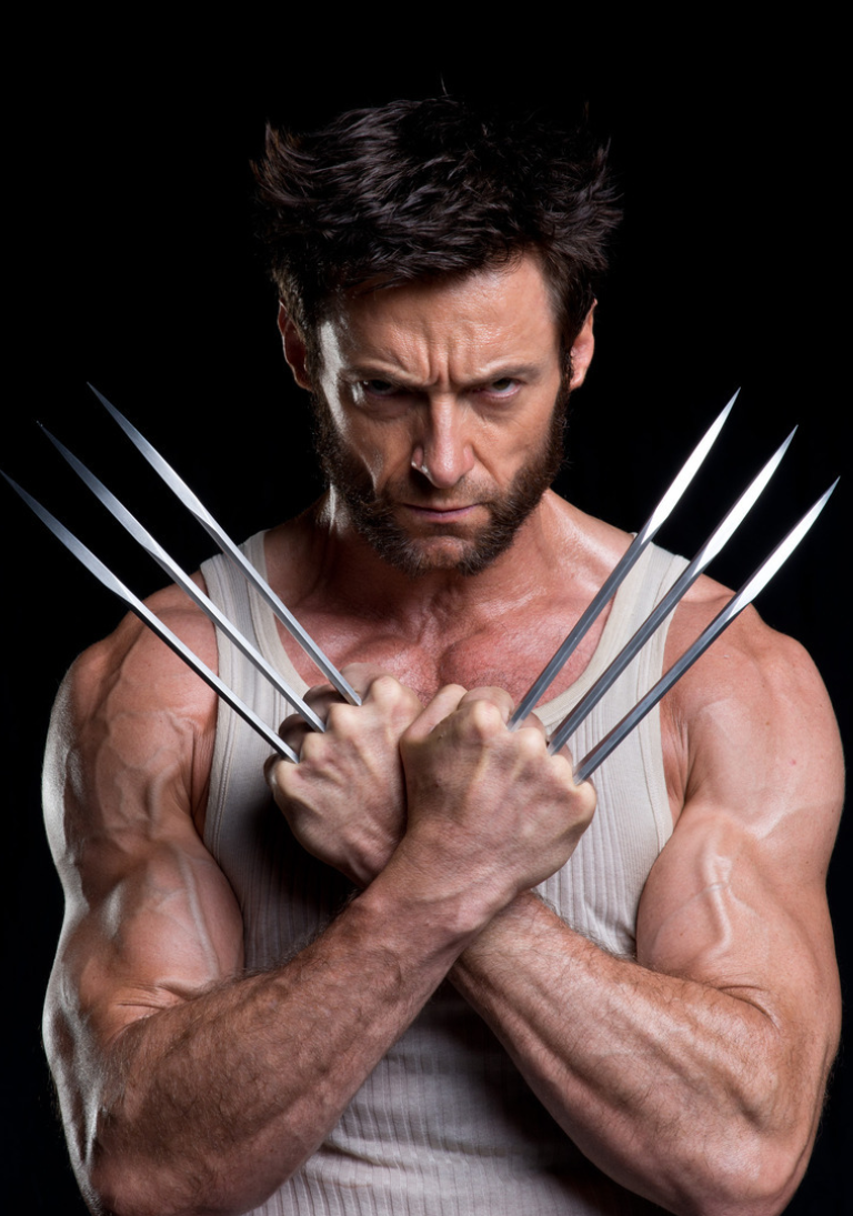 the image depicts hugh jackman as wolverine, a marvel comics superhero. he is portrayed in a portrait with his arms crossed, displaying his iconic adamantium claws. his muscular build is visible, and he is wearing a white tank top. the background is black, emphasizing the character's menacing expression.