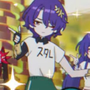 the image features an anime girl with long purple hair, she is wearing a white shirt with a bow tie and green pants. she has a big smile on her face and looks like she is happily posing.  there is some japanese writing on her shirt. there is another girl with purple hair in the background.  she is out of focus.