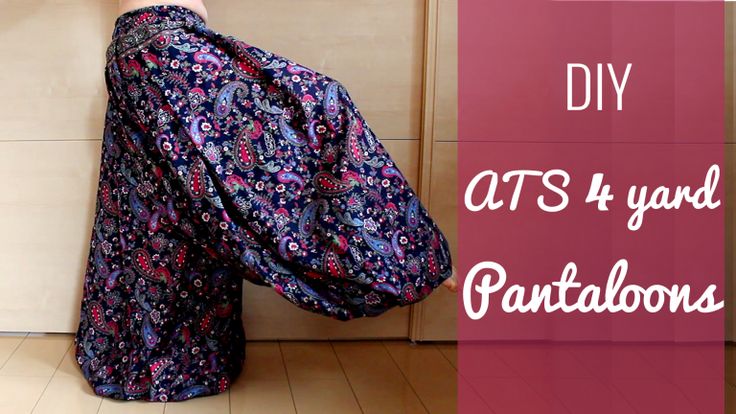 a person wearing patterned, dark blue pantaloon style trousers is shown with text written on the right side of the image saying "diy ats 4 yard pantaloons." the pattern on the pants is paisley and has red, purple and blue colored shapes on the fabric.