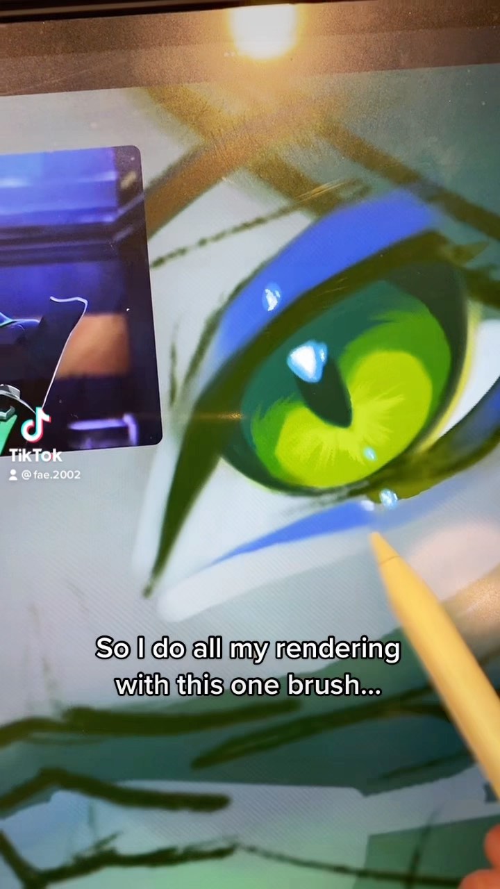 a closeup shot of a digital artist's screen showing the process of painting a stylized eye. the artist is using a single brush to render the details, and a yellow stylus is visible in the lower right corner.  a small tiktok watermark is present in the upper left corner. the text overlay states "so i do all my rendering with this one brush..." indicating the artist's technique. the eye is predominantly green with a bluetoned eyelid. the background of the screen shows other artwork and a workspace.