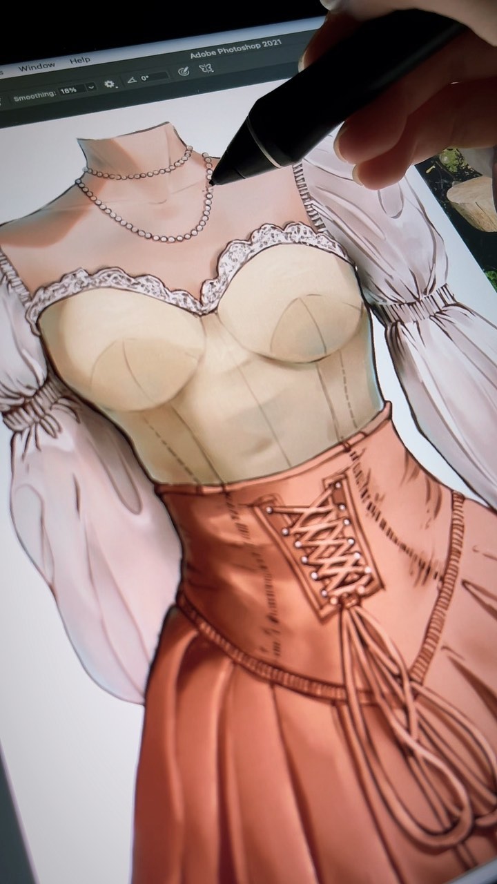 a closeup shot of a hand using a stylus to digitally paint a woman's medievalstyle dress on a tablet. the dress is a light orange color with a corsetlike bodice and a full skirt. the artist is working on the details of the dress, adding shading and texture. the image shows the process of digital art creation.