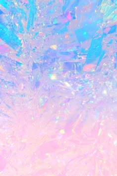 a dreamy and whimsical abstract background of blurry, iridescent light in pastel colors. it is made of holographic glitter and sparkles and evokes a feeling of magic and wonder.