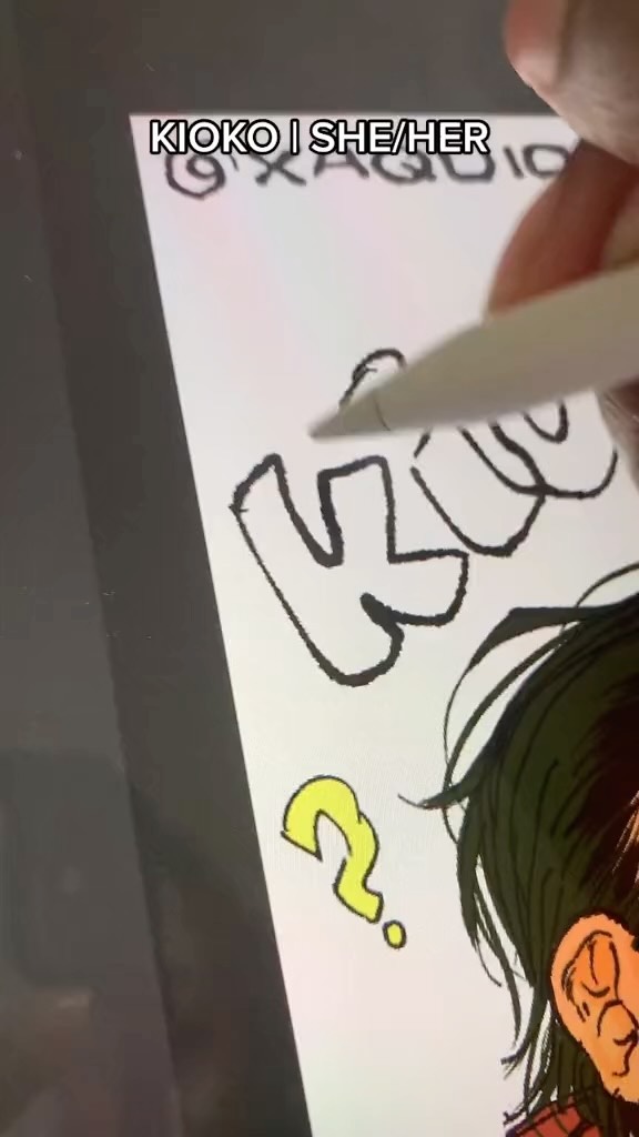 closeup shot of a hand using a stylus to draw on a digital tablet. the artwork is in a manga or anime style and features a character's head and shoulder with a question mark next to it. the name "kioko | she/her" is visible at the top of the screen. the artist is in the process of drawing the character's hair.