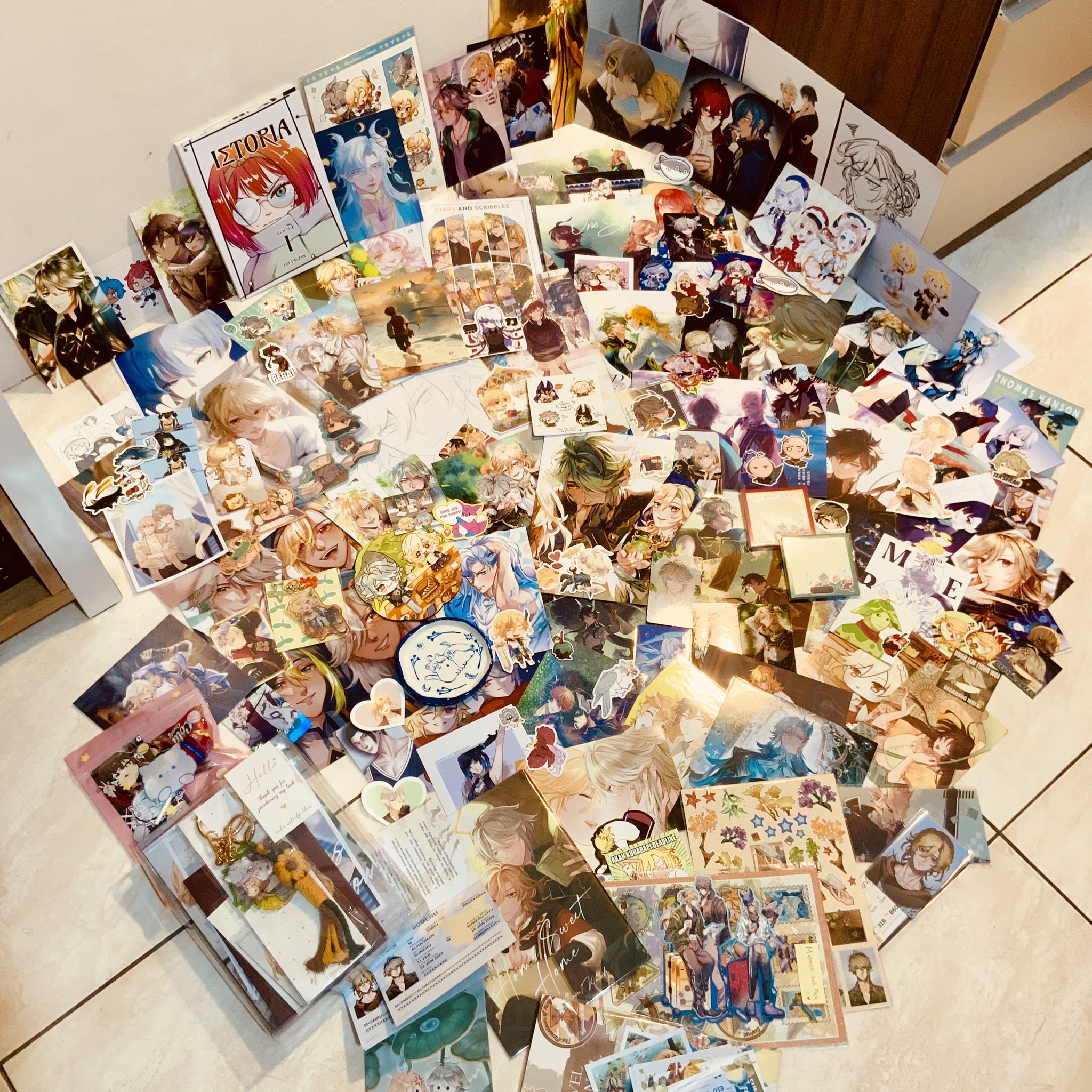 a large collection of anime/manga stickers and cards featuring characters from a romance game, possibly an otome game. the collection is spread out on the floor and includes various scenes and character portraits. the cards and stickers are arranged in a seemingly random order, but there are several that seem to be paired together, suggesting that they are from the same story or game. the image is a vibrant and colourful testament to the passion and dedication of fans of the game, showcasing their love for the characters and story.
