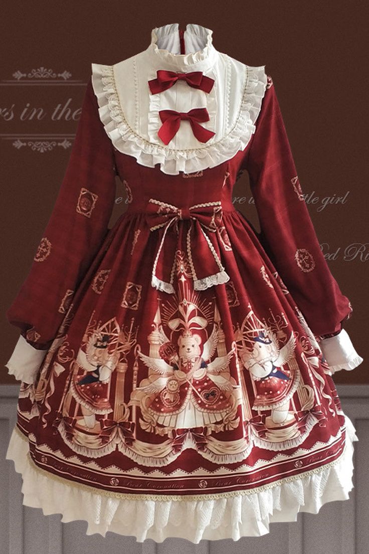 a frilly, lolitastyle dress in a christmas theme is displayed on a mannequin. the dress is predominantly red and features prints of teddy bears dressed as angels.