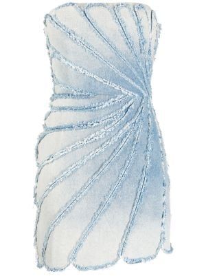 a light blue denim mini dress is featured in the image. the dress is strapless and has a unique design with radiating, slightly fringed panels that create a decorative effect. the denim has a light wash and the overall style is casual and fashionable.