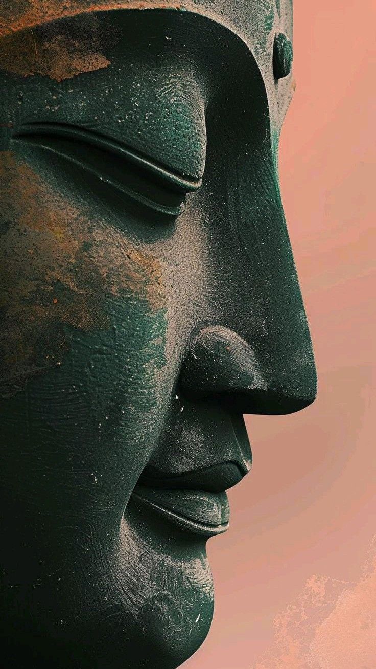 a closeup profile shot of a green buddha statue's face, evoking a sense of serenity, meditation, and spirituality.