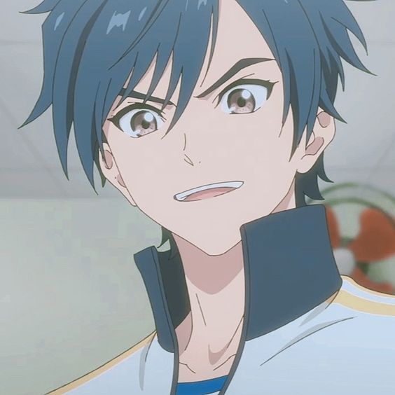 the image shows a young man with short, spiky blue hair and brown eyes. he is wearing a white and blue jacket and has a confident grin on his face. the image appears to be a still from an anime or manga series.