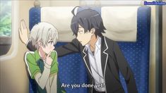two anime boys on a train. the boy on the left has short white hair and is wearing a green and white shirt. the boy on the right has short black hair and is wearing a white shirt with a black jacket. he is leaning in close to the other boy. the caption reads, "are you done yet?".