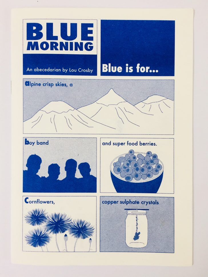 the image is a page from a book titled "blue morning", which is described as "an abecedarian by lou crosby". the page is titled "blue is for..." and features illustrations in blue ink on a cream background. the illustrations depict an alpine landscape, a boy band, a bowl of blueberries, cornflowers, and copper sulphate crystals. the text lists these items as examples of things that are blue.