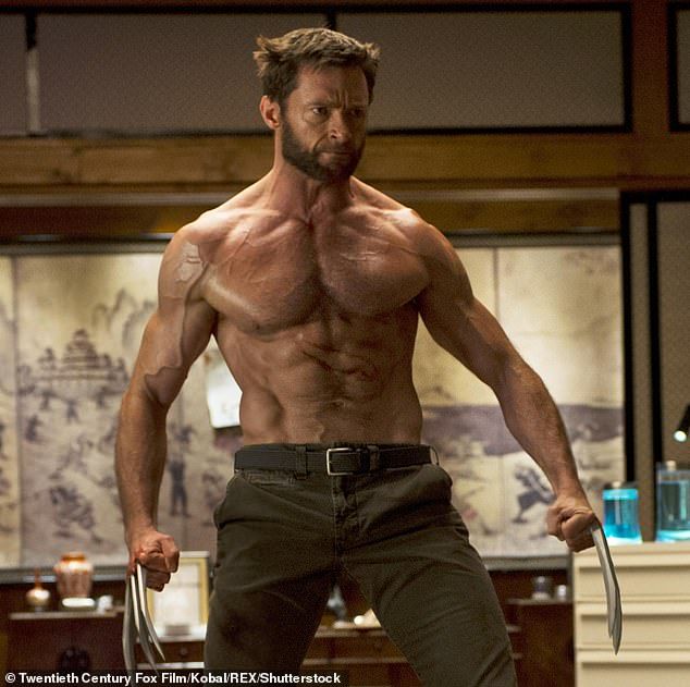 hugh jackman poses as wolverine from the xmen movie franchise. he's shirtless, muscular, and holding his claws in a dramatic pose.