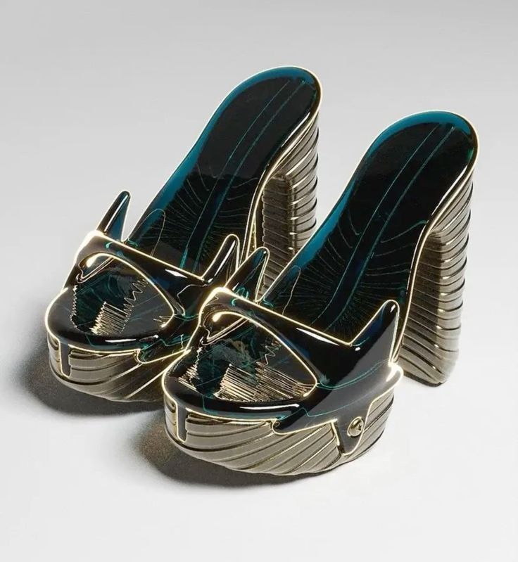 a closeup shot of a pair of futuristic, highheeled platform sandals. the shoes are predominantly dark teal with gold metallic accents.  they have a unique, sculpted design with intricate details that appear almost abstract. the heels are high and thick, and the sandals have a slingback style. the image appears to be a 3d render, showcasing the shoes' glossy finish and highlighting the metallic details.  the background is a simple, light gray, focusing attention on the shoes.
