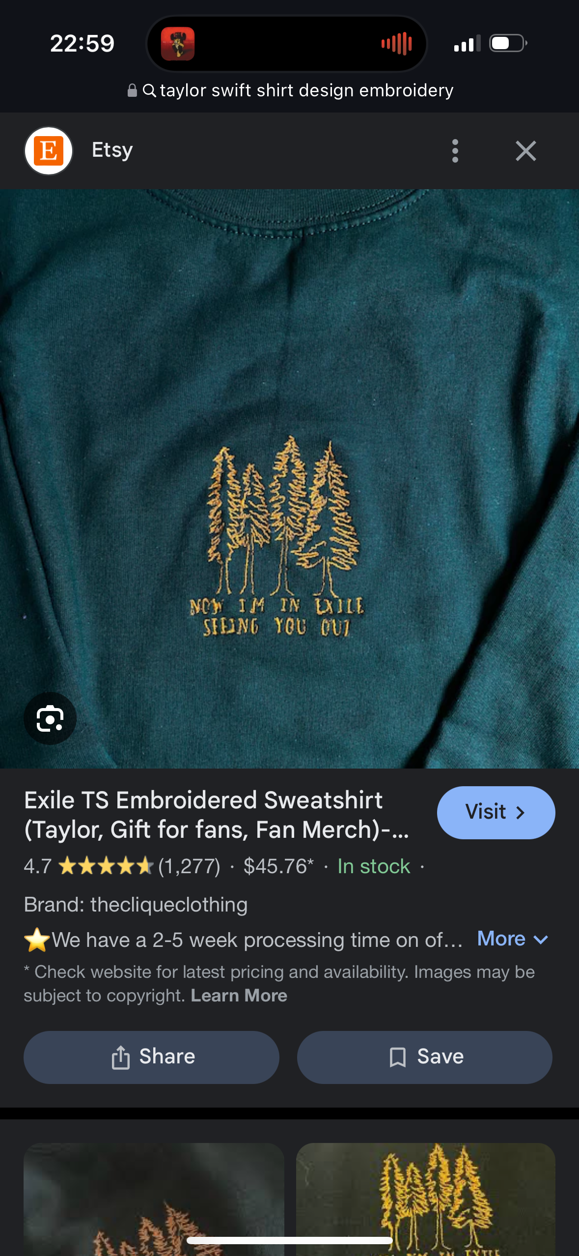 this is a product image for an embroidered sweatshirt featuring a gold embroidery design of the words "now i'm in exile seeing you out" with three trees in the background. the sweatshirt is a dark teal green. the image is a closeup shot of the front of the sweatshirt. the sweatshirt is laid flat on a surface.  the image is taken in a good lighting and the colors are vivid.