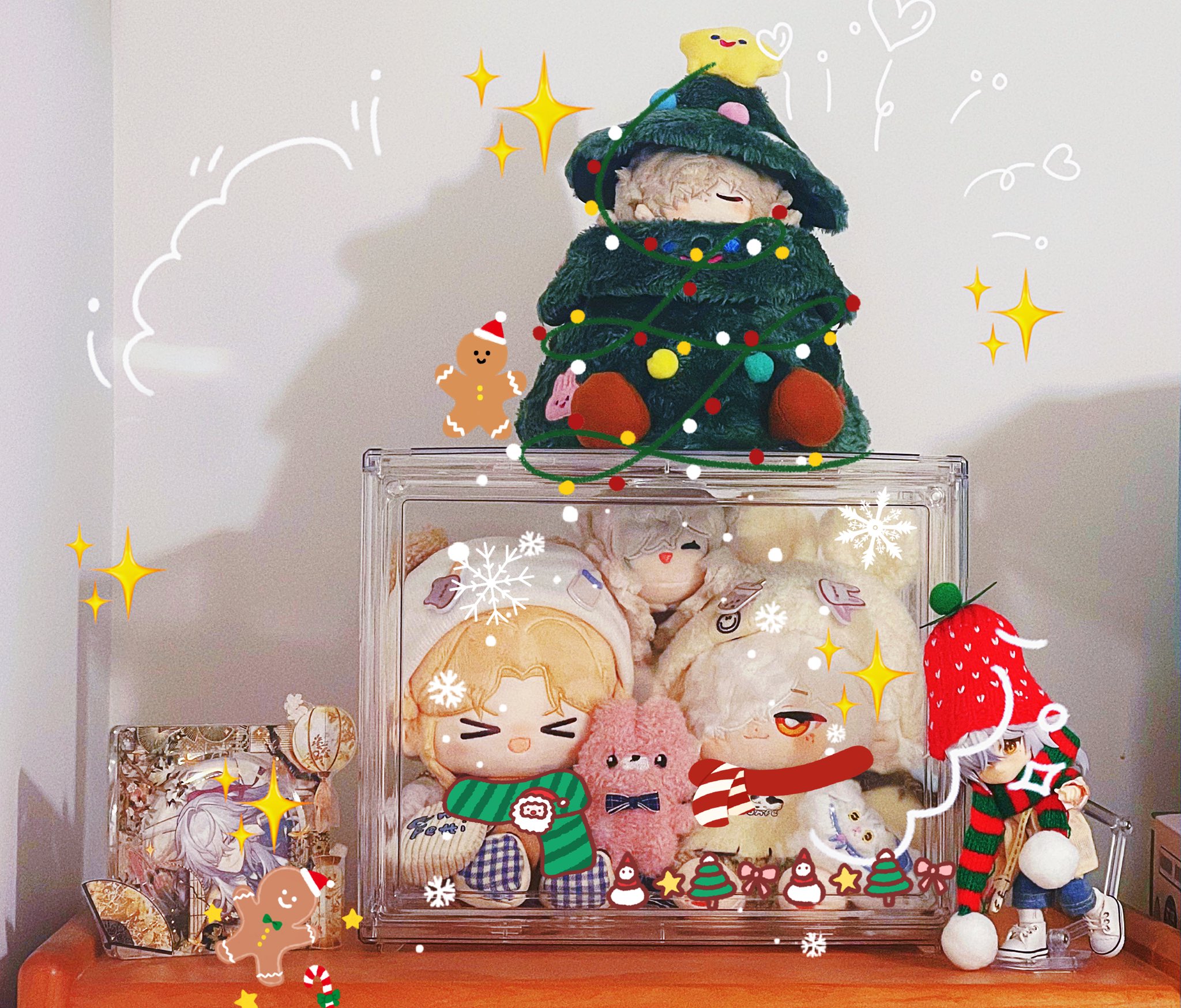 a closeup shot of a glass box filled with various christmasthemed stuffed toys. the box is sitting on a table, and there is a small christmas tree with a plush toy sitting on top of it. the toys inside the box include a penguin, a santa claus, a gingerbread man, a reindeer, and a snowman. the scene is decorated with colorful christmas ornaments and lights.
