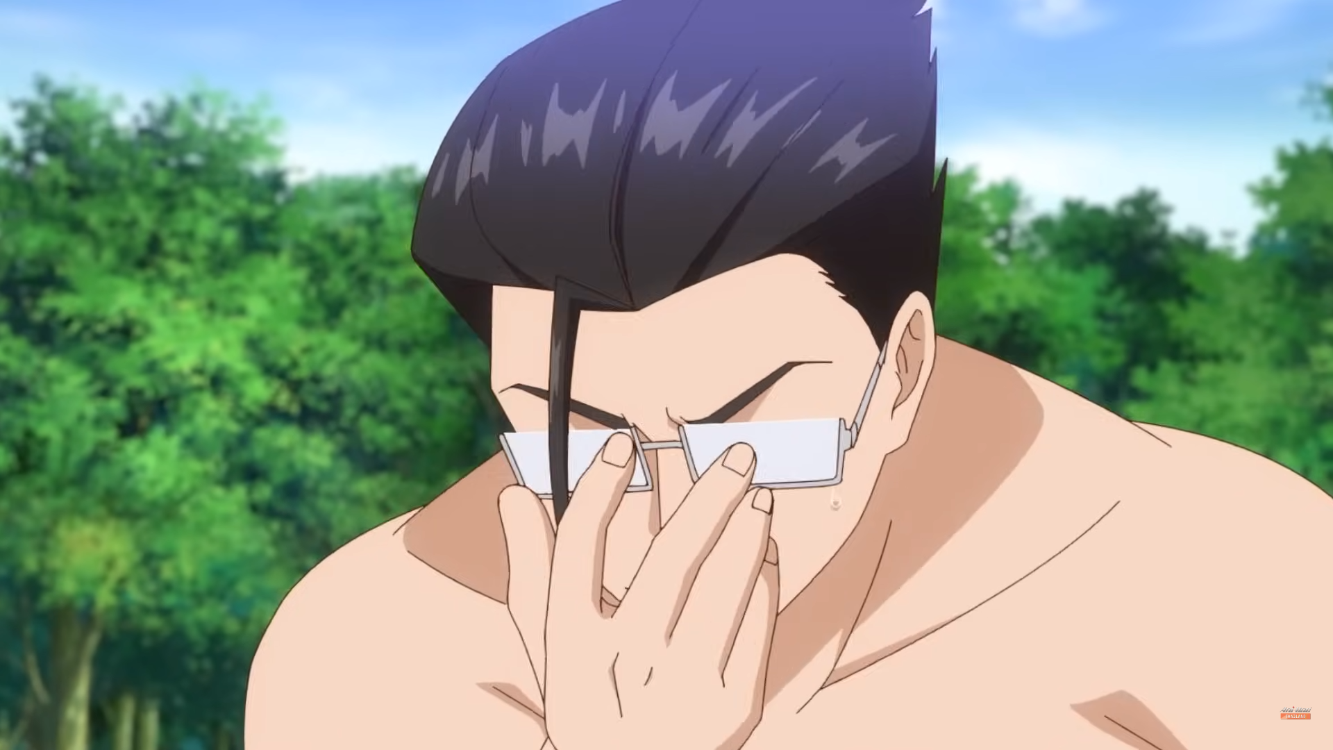 the image shows a closeup of an anime man with short, dark hair and a muscular build. he is shirtless and standing outdoors with a backdrop of green trees. he wears thin, rectangular glasses that he is pushing up the bridge of his nose with his right index finger. his expression is serious and perhaps slightly troubled as he looks downwards. the overall lighting is bright, suggesting a daytime scene.