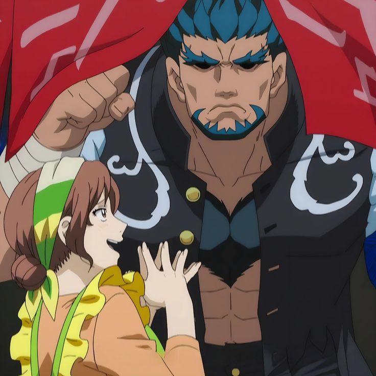 the image is a cartoon drawing of a large, muscular man with a serious expression standing over a smaller, smiling woman. he has blue hair and a beard, and is wearing a black jacket with white details. the woman has brown hair, and is wearing a yellow and green apron. the man is partially hidden by a red cloth. the scene is likely from an anime or manga series.