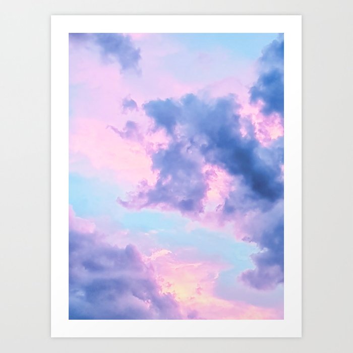 the image is of a dreamy pastel sky filled with fluffy clouds. the clouds are illuminated from behind, creating a backlit effect. the overall feel of the image is ethereal and whimsical.