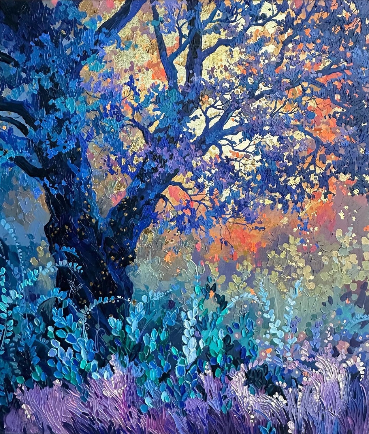 a painting of a tree in a forest at dusk. the leaves of the tree are a variety of blues and greens, and the trunk is brown. the sky is a mix of orange, yellow, and purple. there is a lot of light and shadow in the painting.