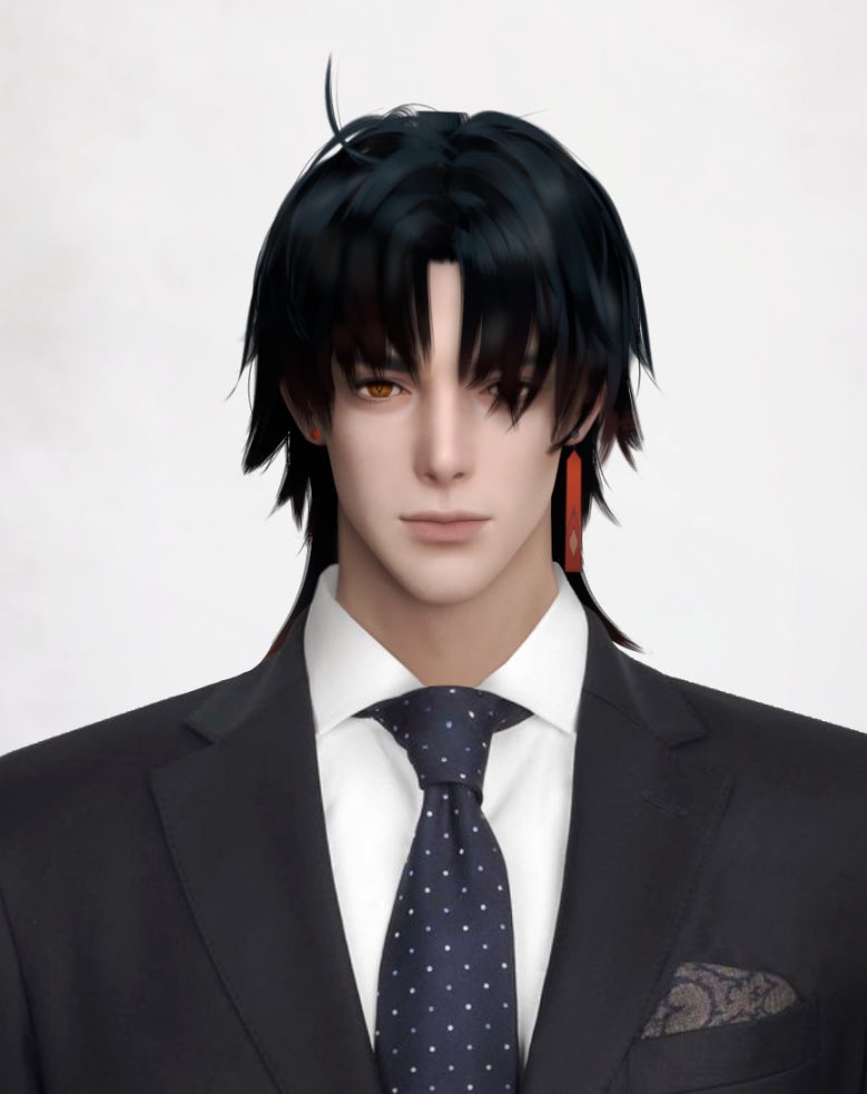 a handsome man in a black suit and a dark blue tie with white polka dots is looking at the camera. the man is wearing a white shirt and has black hair with dark red earrings.  the image is a portrait and is welllit.