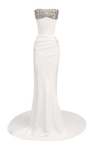 a white, strapless mermaid gown with beadwork across the top.